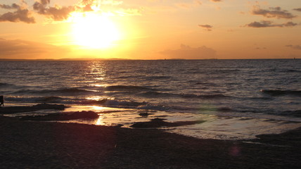 Obraz na płótnie Canvas Zachód słońca nad morzem