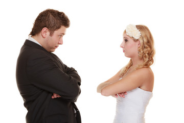 bride and groom looking at each other offended