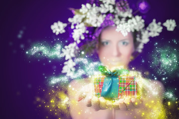 Christmas shopping winter magic woman holding gift, hairstyle and makeup