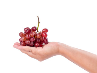bunch of red grapes on woman's hand isolated