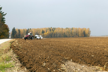 Fototapeta premium plowed field by a tractor 
