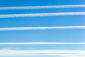 Chemtrails on blue sky
