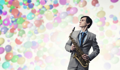 Obraz premium Handsome saxophonist. Concept image