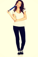 Thoughtful woman with big pencil.