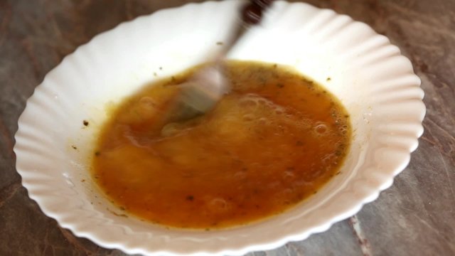 Cook preparing hen egg mixture for cooking and deep frying
