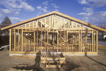 Wood frame of house under construction,  Lone Pine, CA