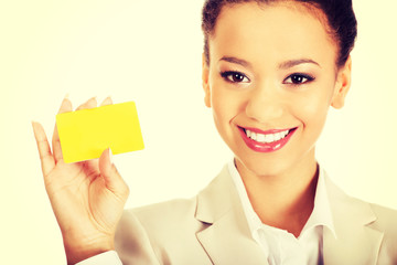 Businesswoman holding a card.