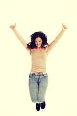 Young casual woman jumping.