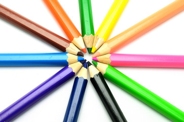 Naklejka premium Colorful vertical pencil crayon border over white