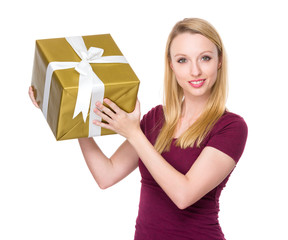 Caucasian young woman hold up with present box