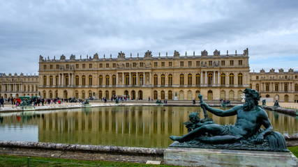 Fototapeta na wymiar Poseidon statue in the garden of Versailles Palace, Paris, France