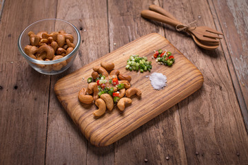 Cashew nuts on chopping block