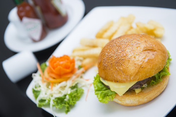 delicious cheese burger with french fries