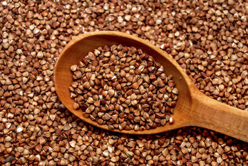 Buckwheat with a wooden spoon