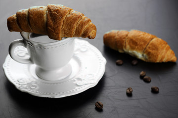 Morning coffee cup croissant