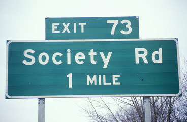 A sign that reads &Ograve;Society Rd 1 mile&Oacute;