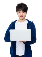 Young man use of the laptop computer