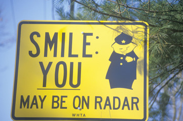 A sign that reads ÒSmile; you may be on radarÓ