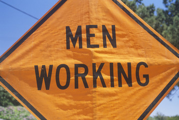 A sign that reads ÒMen workingÓ
