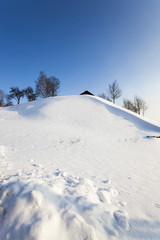 Fototapeta na wymiar snow covered hill 
