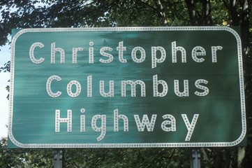 A sign that reads &Ograve;Christopher Columbus Highway&Oacute;