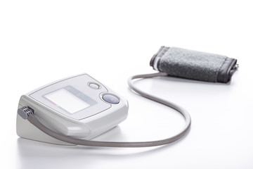 Obraz premium Digital Blood Pressure Monitor closeup on white