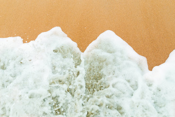 Calm sea waves breaking on sandy beach as background resources