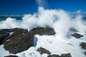 flying foam by the shore