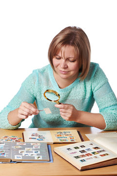 Woman watching postage stamps