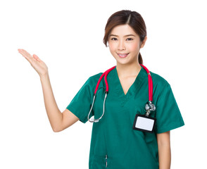 Young Doctor with hand showing blank sign