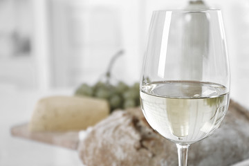 Still life of wine, grape, cheese and bread,  black and white retro stylization