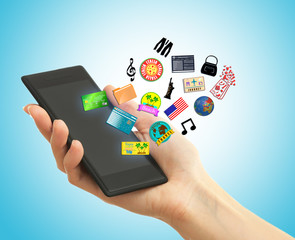 Hand holding smartphone with travel cons