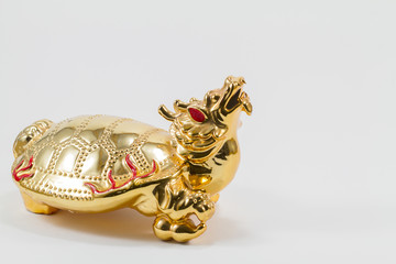Golden half  turtle and dragon isolated on white background