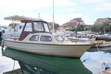 Fototapeta premium The image of an passenger motor boat in a hubborn of Tivat, Montenegro