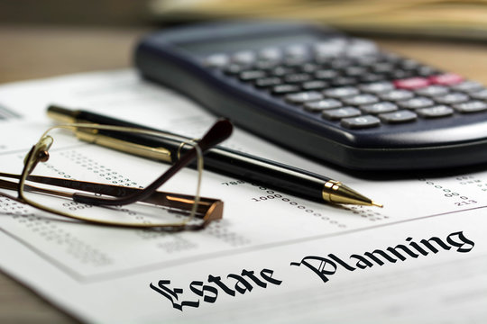 Estate Planning. Calculator, Glasses And Black Pen On Financial Documents