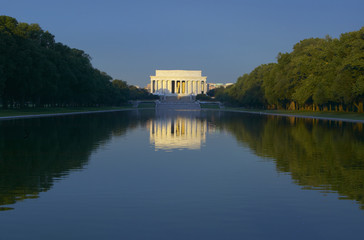 The Lincoln Memorial and Reflecting pond at sunrise in Washington D.C.