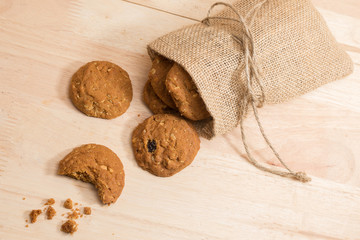 Cookie in woven sack on wood