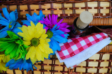 Picnic baskets with flowers and wine