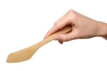 wooden knife in the hand of women isolated on white background