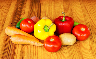 Composition with raw vegetables on wooden table