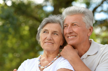 Mature couple on  walk  in summer