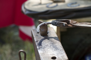 blacksmith makes a horseshoe  close-up
