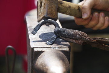 blacksmith makes a horseshoe  close-up