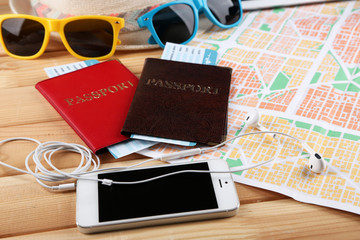 Sunglasses, passports, Digital tablet and map, close up. Preparing for travel concept