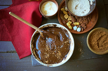 Preparing dough for chocolate pie on table close up