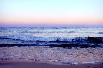 Fototapeta na wymiar View of beautiful sunset on the beach