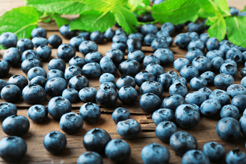 Fresh blueberries on wooden table, closeup