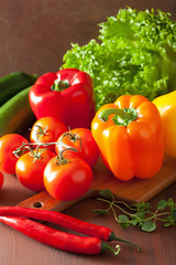 healthy vegetables pepper tomato salad on rustic background