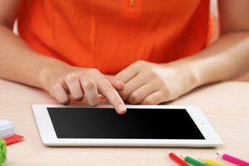 Obraz na płótnie Canvas Woman using digital tablet on workplace close up