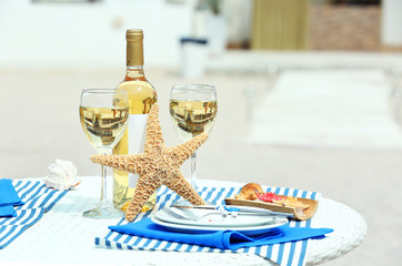 Served decorated table on sea background